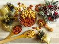 Roasted Natural Almond Nuts Badam and Cashew in a porcelain bowl and Christmas home decoration. Royalty Free Stock Photo