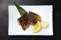 Roasted Okhotsk Atka mackerel on a dining table Royalty Free Stock Photo