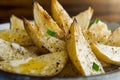 Roasted parsnip wedges with melted butter in warm natural light