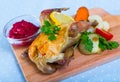 Roasted partridge with cranberry sauce and grilled vegetables