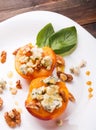 Roasted peaches with dorblu cheese Royalty Free Stock Photo