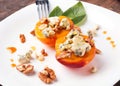 Roasted peaches with dorblu cheese Royalty Free Stock Photo