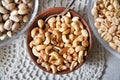 Roasted peanuts assortment on brown plate Royalty Free Stock Photo