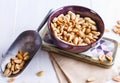 Roasted peanuts on a bowl over white wooden background Royalty Free Stock Photo