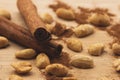 Roasted peanuts with cinnamon sticks, cinamon powder on top of wood table. Royalty Free Stock Photo