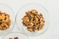 Roasted peanuts isolated in glass bowl, on white background Royalty Free Stock Photo