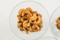 Roasted peanuts isolated in glass bowl, on white background Royalty Free Stock Photo