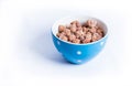 Roasted peanuts with sugar in blue bowl Royalty Free Stock Photo