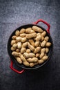 Roasted peanuts. Tasty groundnuts in pot Royalty Free Stock Photo