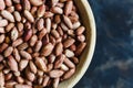 Roasted peanuts in wooden bowl Royalty Free Stock Photo