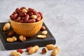 Roasted peeled peanuts in ceramic bowl  , closeup, copy space Royalty Free Stock Photo