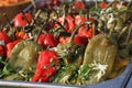 Roasted peeled peppers for salad on a daylight. Red and green peeled peppers with garlic and parsley Royalty Free Stock Photo