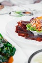 Roasted Peking duck crispy skin with sweet sauce on thin pancake wrap Royalty Free Stock Photo