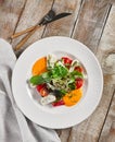 Roasted pepper salad with calamari and fresh greens