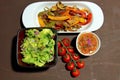 Roasted peppers with guacamole and salsa