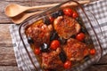 Roasted pieces of chicken with mustard, tomatoes and mushrooms. Royalty Free Stock Photo