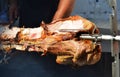 Roasted pig meat on a spit Royalty Free Stock Photo