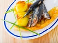 Roasted pilchards with potato balls and focaccia Royalty Free Stock Photo