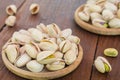 Roasted pistachios on wooden plate