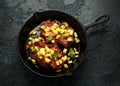 Roasted Pork chops with caramelized apples, walnuts and sage in a cast iron pan Royalty Free Stock Photo