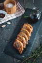 Roasted pork chops with fresh rosemary on dark background, top view Royalty Free Stock Photo