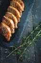 Roasted pork chops with fresh rosemary on dark background, top view Royalty Free Stock Photo