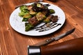 Roasted pork and grilled vegetables on wooden background Royalty Free Stock Photo