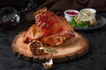 Roasted pork knuckle eisbein with cabbage and mustard on wooden cutting board Royalty Free Stock Photo