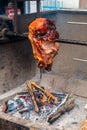 Roasted pork leg on spit Royalty Free Stock Photo