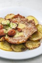 roasted pork meat with sausage, mustard sauce and roasted potatoes Royalty Free Stock Photo