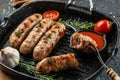 Roasted pork meat sausages on the grill pan. banner, menu, recipe place for text, top view Royalty Free Stock Photo