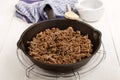 Roasted pork mince with crushed peppercorns in a cast iron pan