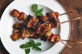 Roasted pork Onion skewer barbecue In white plate
