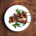 Roasted pork Onion skewer barbecue In white plate