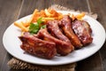 Roasted pork ribs and potato fries Royalty Free Stock Photo