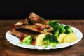 Roasted pork ribs with potatoes and broccoli Royalty Free Stock Photo