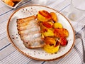Roasted pork ribs served with fried baked potatoes Royalty Free Stock Photo
