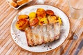 Roasted pork ribs served with fried baked potatoes Royalty Free Stock Photo