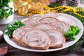 Roasted pork roll on the plate. New year`s appetizer Royalty Free Stock Photo