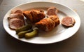 Roasted pork roll stuffed . Meat rolls. white pepper black pepper, spices on old wooden board Royalty Free Stock Photo