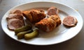 Roasted pork roll stuffed . Meat rolls. white pepper black pepper, spices on old wooden board Royalty Free Stock Photo