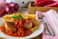 Roasted pork tenderloin with puszta sauce and french fries Royalty Free Stock Photo