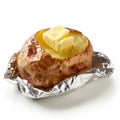 Roasted potato with butter in foil isolated on white Royalty Free Stock Photo