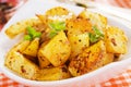 Roasted potato in white bowl