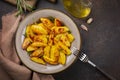 Roasted potatoes with garlic, olive oil and rosemary. Ingredients. Vegan food.