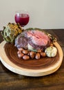 Roasted Prime Rib Steak with buttered artichoke, rosemary roasted small red potatoes