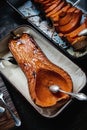 Roasted pumpkin in a roasting pan Royalty Free Stock Photo