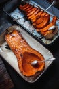 Roasted pumpkin in a roasting pan Royalty Free Stock Photo