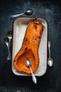 Roasted pumpkin in a roasting pan Royalty Free Stock Photo