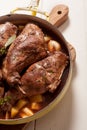 Roasted Rabbit Haunch in Pan with Fresh Herbs Royalty Free Stock Photo